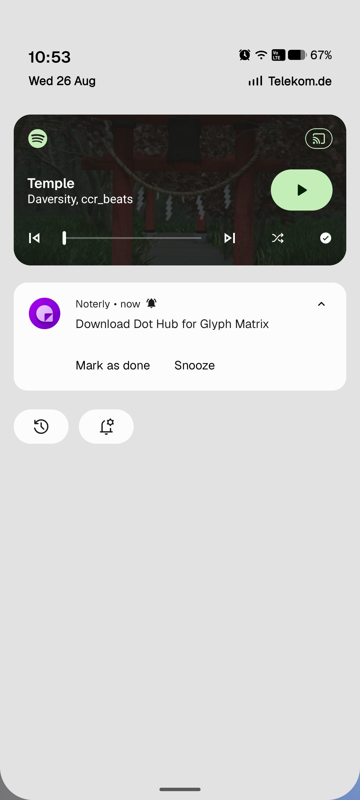 The notification shade on its own: date and carrier at the top, a media player card and a single notification with Mark as done and Snooze actions. No Quick Settings tiles.