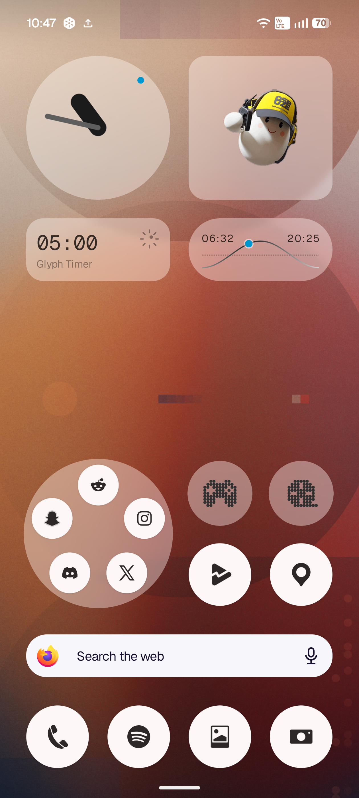 The identical Lucent homescreen over a warm red and orange wallpaper: the same widgets now read in warm tones and with less contrast.